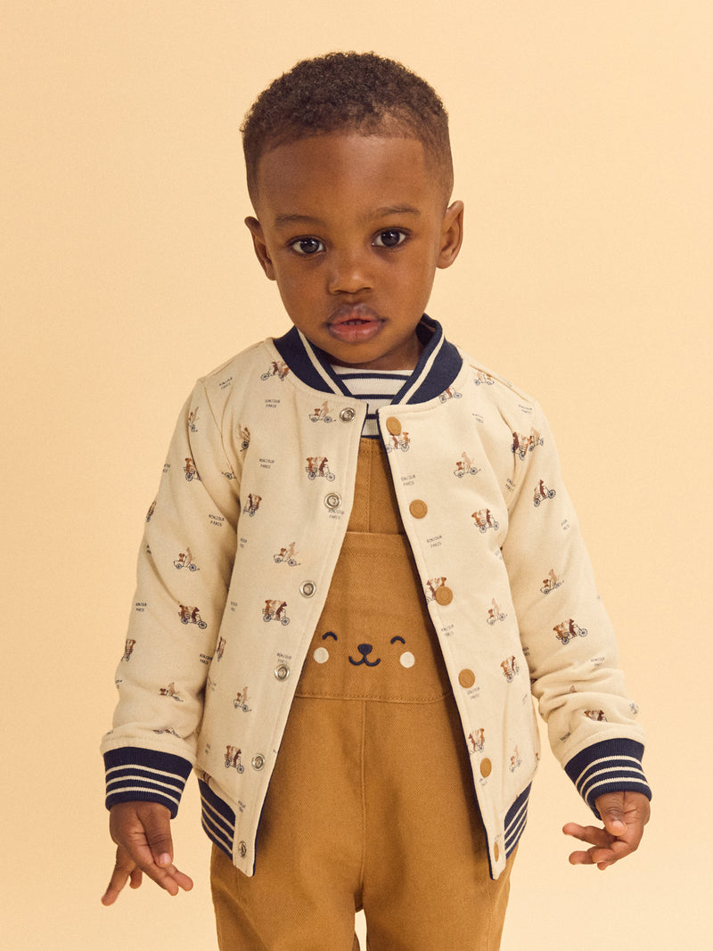 Reversibler Teddy in Marineblau oder Elfenbein mit Hundemuster für Baby Jungen