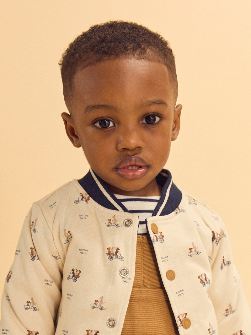 Reversibler Teddy in Marineblau oder Elfenbein mit Hundemuster für Baby Jungen
